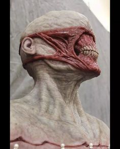 the head and neck of an alien creature