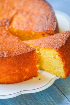 a cake that is sitting on a plate with one slice cut out and ready to be eaten