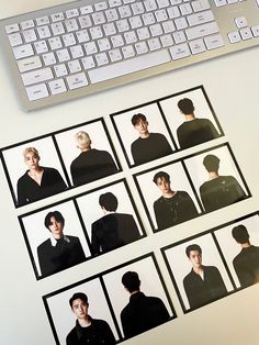 a computer keyboard sitting on top of a desk next to pictures of people in black and white