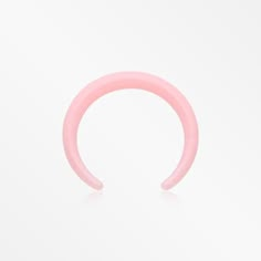 a pink plastic ring on a white background