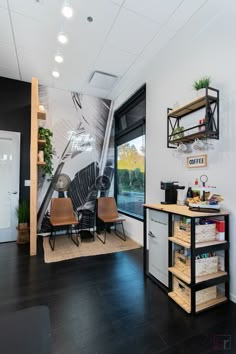 This hair salon studio in Murrieta, California has a white theme with modern wood fixtures and plant accents to create a clean, modern feel. Hair Salon In Living Room, Processing Room Salon, Black And White Hair Salon Ideas, Aesthetic Hair Salon Ideas, Salon Set Up Ideas Layout, 1000 Sq Ft Salon Layout, Edgy Salon Interior Design, Hair Salon Accent Wall, Hair Salon Paint Colors Ideas