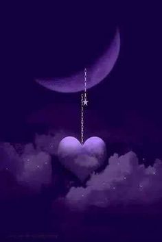 a heart hanging from a chain with the moon and stars in the sky behind it