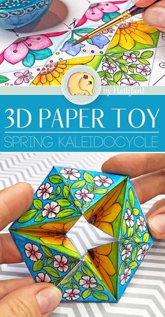 the 3d paper toy is being used to make an origami flower arrangement with scissors