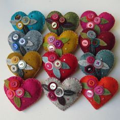 a group of heart shaped buttons sitting on top of a table