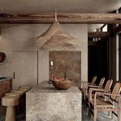 a large bowl sitting on top of a counter next to chairs