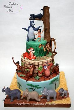 a three tiered cake with animals on it