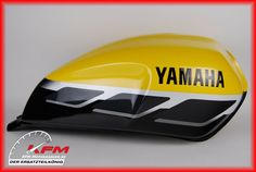 a yellow and black motorcycle helmet with the words yamaha on it's front side