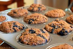 muffins with blueberries are sitting in the pan