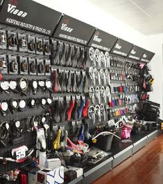 there are many different types of tools on the wall in this shop that is filled with various items