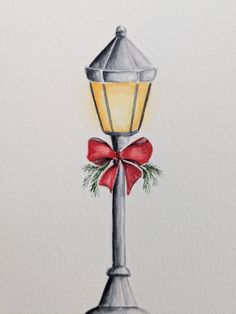 a drawing of a street light with a red bow on it's front and side