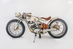 an old motorcycle is shown on a white background