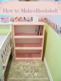 there is a pink book shelf in the corner of this child's room with princess wallpaper