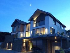 a large house with lots of windows lit up at night