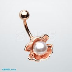 a rose shaped belly ring with a pearl in the middle and a flower on top