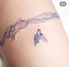 a woman with a tattoo on her thigh