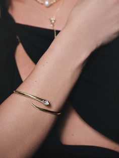 Known for its killer reputation, our Snake Bracelet is bound to become an everyday staple. This spiral bangle bracelet will add a unique touch to your look that everyone will be jealous of. Want more snake jewelry styles? Shop our In The Garden Collection. | Gold Spiral Snake Bangle Bracelet | Women's Jewelry by Uncommon James Elegant Snake-shaped Bangle For Gift, Snake Bangle Bracelet, Snake Cuff Bracelet, Gold Snake Jewelry, Spiral Snake, Luxury Elegant Snake-shaped Bracelet, Elegant Gold Snake-shaped Bangle, Snake Bangle, Uncommon James