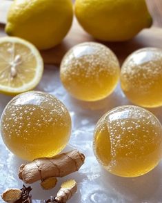 lemons and ginger root on ice with water droplets