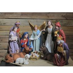 a nativity scene with figurines of people and animals