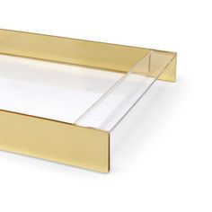 a gold tray with clear sides on a white background