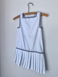 This vintage white dress is perfect for a hot day.  Great nautical or tennis look by Absorba.  Marked a 6, this fits a bit smaller.  Measures 12" flat across the chest and 23.5"  in total length.  Excellent condition. White Pleated Dress, Vintage White Dress, White Vintage Dress, Hot Day, Hot Days, Pleated Dress, White Vintage, Labour Day, Nautical