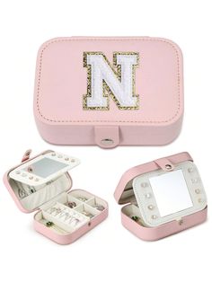 a pink case with the letter n on it's side and two compartments open