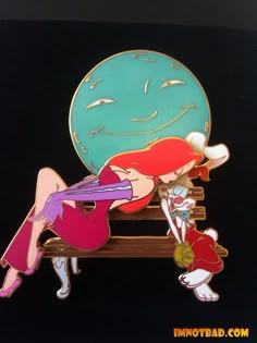 a pin with an image of a woman laying on a bench next to a clock