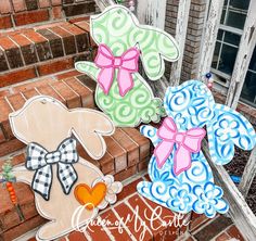 three handmade easter bunnies are sitting on the steps