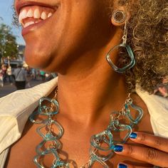 What happens when you cross an empty mini bar gin bottle with our wavy glass studio technique? Magic baby blue ruffle glass! These beautiful earrings are both stunning and light and easy to wear. Finished with sterling boomerang ear wires. Glass is approximately 1 inch by 1 inch. Earring length (drop) is approximately 2 inches. Patented.  Aqua from a Bombay Sapphire Gin bottle Recycled glass and sterling silver Bombay Sapphire Gin, Stocking Fillers For Him, Bombay Sapphire, Gin Bottle, Smart Glass, Sustainable Accessories, Glass Studio, Stocking Fillers For Her, Recycled Jewelry