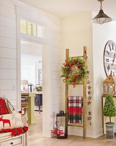 a living room filled with furniture and christmas decorations