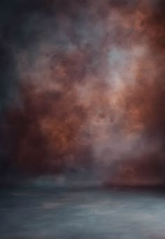 an abstract painting of red and orange clouds