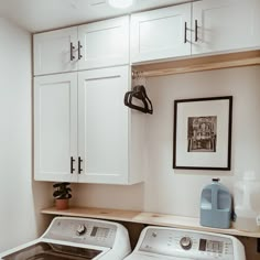 a washer and dryer in a small room