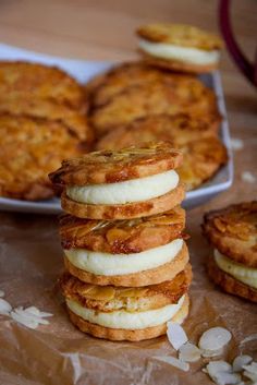 there are some cookies on the table and one is stacked up with another cookie in the background