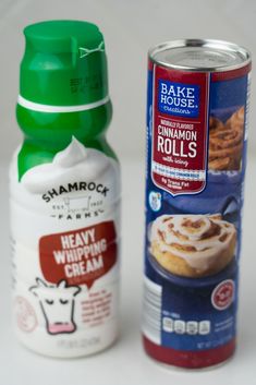 two cans of cinnamon rolls and a can of bake house cinnamon rolls with frosting