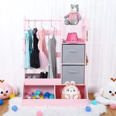 a toy closet with clothes and toys in it