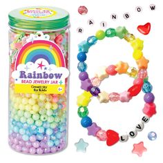 a jar filled with beads next to a rainbow bracelet