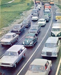 an old photo of cars and trucks on a highway in the 1950's or early 1960s's