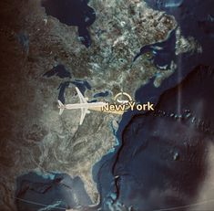 an airplane flying over the map of new york