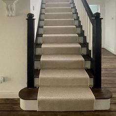 the stairs in this house are lined with carpet