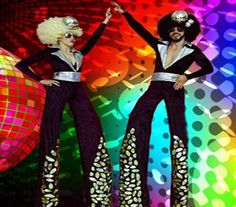 two women dressed in disco costumes standing next to each other with their hands up and arms outstretched