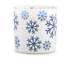 a blue and white cup with snowflakes on the inside, sitting in front of a white background