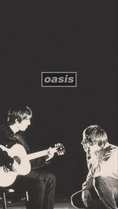 two young men playing guitars on stage with the words oasis above them in black and white