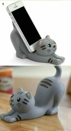 there is a cell phone holder in the shape of a cat