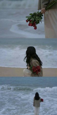 a woman standing on top of a beach next to the ocean with flowers in her hand