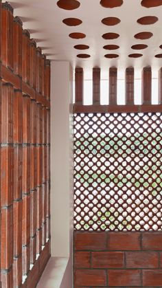 the inside of a building with wooden lattices on it