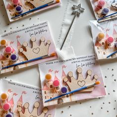 several greeting cards with princess crowns on them and pencils in front of the card