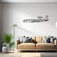 a living room with a couch, lamp and wall decal in the shape of an airplane