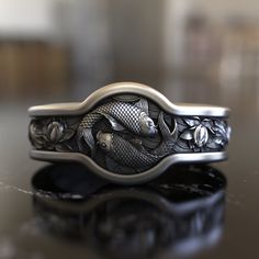 Experience the harmony of Eastern philosophy and artistry with our Yin Yang Carp Koi Fish 925 Sterling Silver Ring. This piece is a tribute to the timeless Yin Yang symbol, representing balance and duality, and the vibrant Koi fish, a symbol of perseverance and good fortune in Japanese culture. Every swirl and curve of the Koi fish has been meticulously crafted, intertwining them in a dance that mirrors the flow of life and energy. The Yin Yang design, seamlessly integrated with the Koi fish, cr Luxury Silver Bohemian Men's Ring, Koy Fish Ring, Symbol Of Balance, Japanese Ornament, Ornament Design, Viking Ring, Masonic Ring, Sterling Silver Mens Rings, Animal Rings