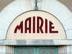 the sign above the door says marie