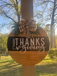 a wooden sign with the words thanks giving on it