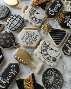 some decorated cookies are laying on a table